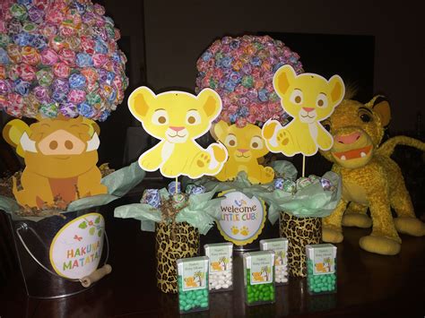 Her request for the theme was some kind of safari/animal theme. Center pieces and party favors | Lion king baby shower ...