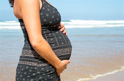 Happy Pregnant Woman On The Beach At The Atlantic Ocean Greens First