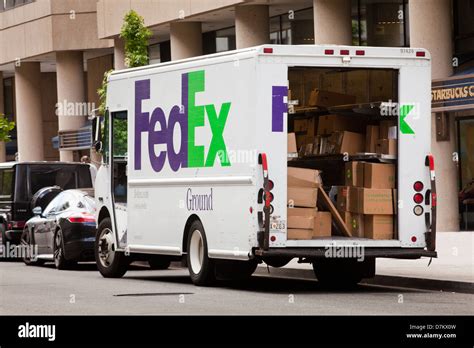 FedEx ground delivery truck with open door - USA Stock Photo - Alamy