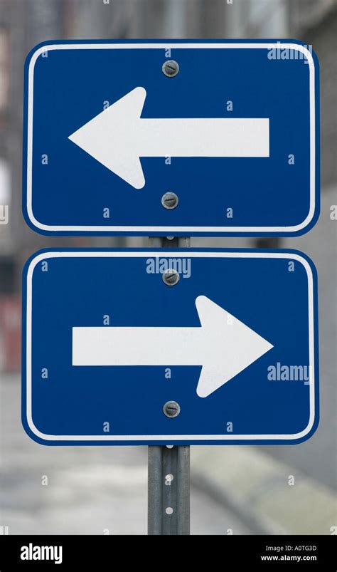 Two Arrows Pointing In Opposite Directions Hi Res Stock Photography And