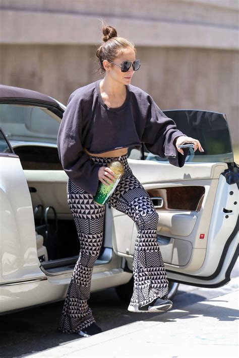 Jennifer Lopez Dons A Cropped Sweatshirt And Patterned Flared Leggings