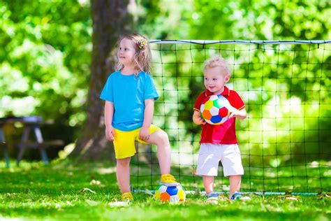 Children Playing Football Outdoors Panaceamk