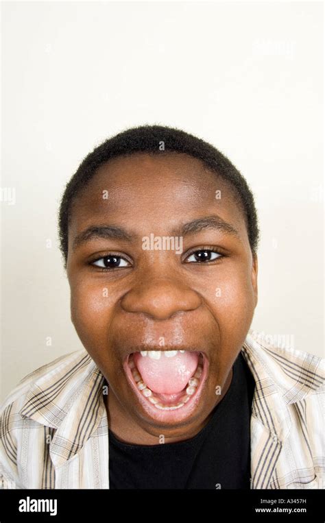 13 Years Old Black Boy Screaming Mouth Wide Open Stock Photo Alamy