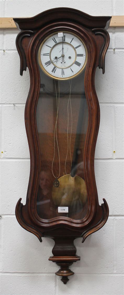 A Late 19th Century Walnut Cased Vienna Style Wall Clock With Eight Day