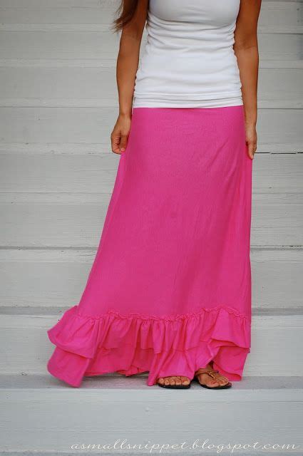 A Woman Wearing A White Tank Top And Pink Skirt Standing On Steps With