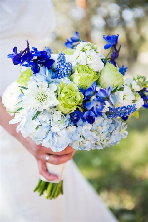 This whimsical garden wedding inspiration filled with lucious purple & blue flowers is exactly why we're crushing so hard on delphiniums in 2020. Fresh New Blue Wedding Bouquets We Adore - MODwedding