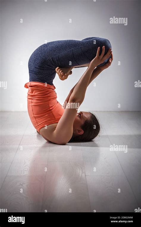Sporty Fit Yogini Woman Practices Inverted Yoga Asana Urdhva Padmasana Lifted Lotus Pose Stock