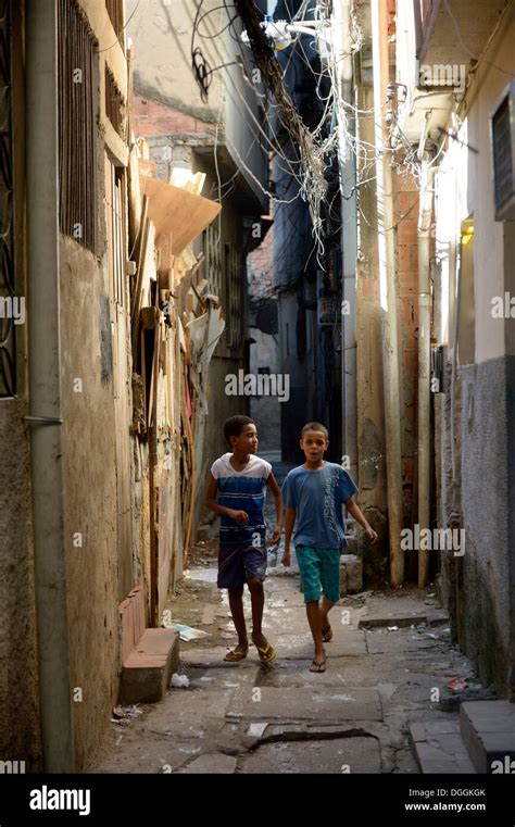 Two Boys In A Narrow Alley In A Slum Or Favela Jacarezinho Favela Rio