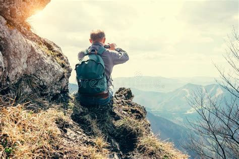 Climber Take A Mountain Landscape Photo On His Smartphone Stock Image
