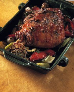 A Roasting Pan Filled With Meat And Vegetables