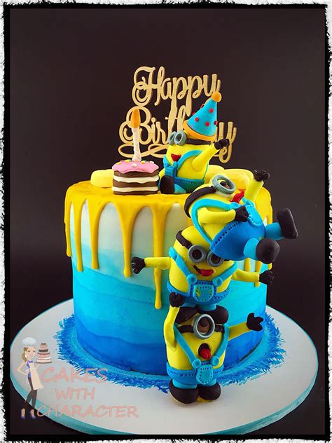 Tower Of Fondant Minions On Ombre Blue Cake With Yellow Chocolate Drip