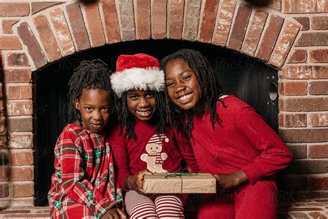 three african american girls wearing christmas pajamas by stocksy contributor gabi bucataru