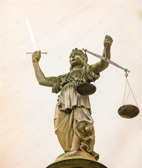 Lady Justice Sculpture With Sword And Scales — Stock Photo © Manfredxy