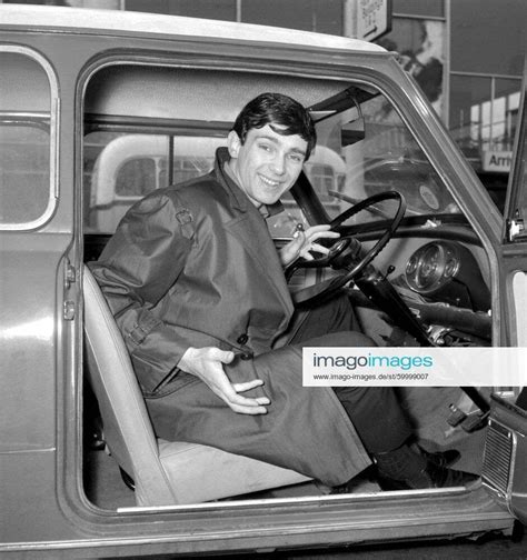Gene Pitney Tries His Hand At The Wheel Of A Mini On His Arrival At
