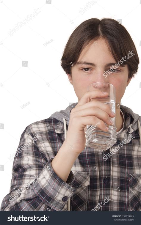 Teenage Boy Drinking Water Isolated On White Background Stock Photo