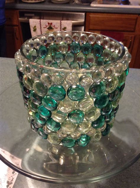 Glass Container With Beads Around It To Give It A Beautiful Decorative