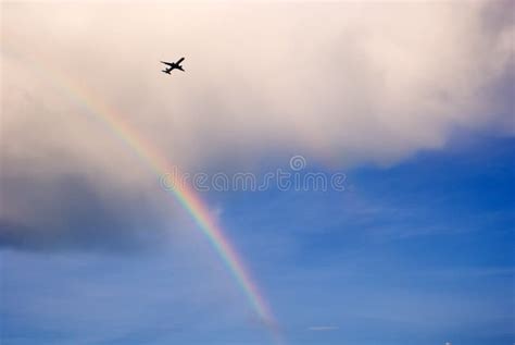 Airplane Flying Over Rainbow Stock Photo Image Of Flying Cloudscape