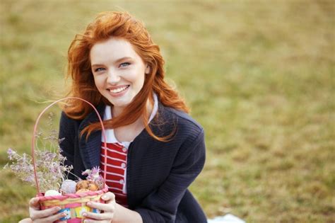 free photo woman with long hair holding easter picnic basket