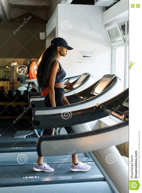 Running On Treadmill In Gym Or Fitness Club Black Woman Exercising To