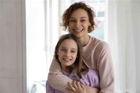 Portrait Of Happy Mom And Teen Daughter Hugging Stock Photo Image Of