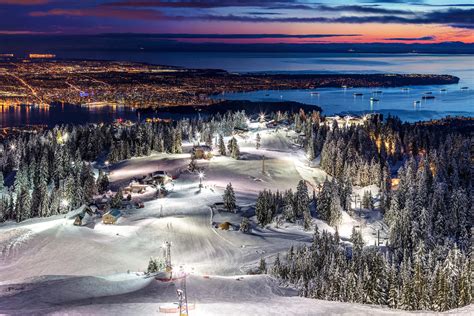 Grouse Mountain Ski Resort At Dusk With A View Of Vancouver City By