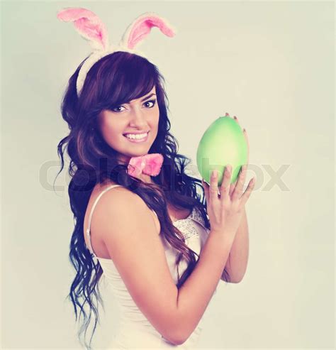 Beautiful Rabbit Holding An Egg Tinted Stock Image Colourbox