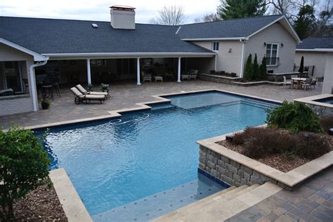 Hardscape Pool With A Custom Landscape Build Into The Back Yard Area