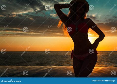 Summer Vacation Silhouette Of Beauty Dancing Woman On Sunset Near The Pool With Ocean View