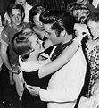 Elvis shares a hug with girlfriend Anita Wood before he boards a train ...