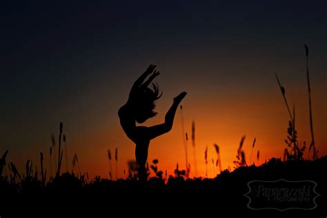 Silhouette Of Dancer In A Field At Sunset Dancing Photo Session Pose Idea For Senior Girl