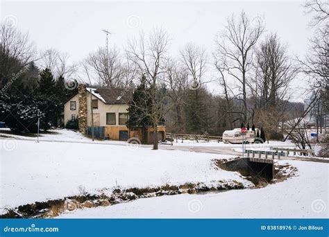 Creek In A Snow Covered Field And House Near Glenville Pennsylvania