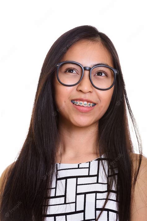 Premium Photo Face Of Young Happy Asian Teenage Nerd Girl Smiling