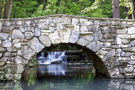 Stone Bridge Over A Cascading Waterfall Stone Bridge Stone Arch Stone