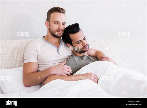 Asleep Gay Couple Lying In Bed Stock Photo Alamy