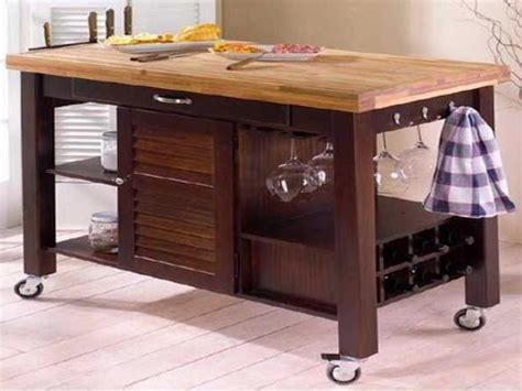 Hidden storage in the kitchen island for, not one, but two foldable tables. Movable Kitchen Islands - YouTube