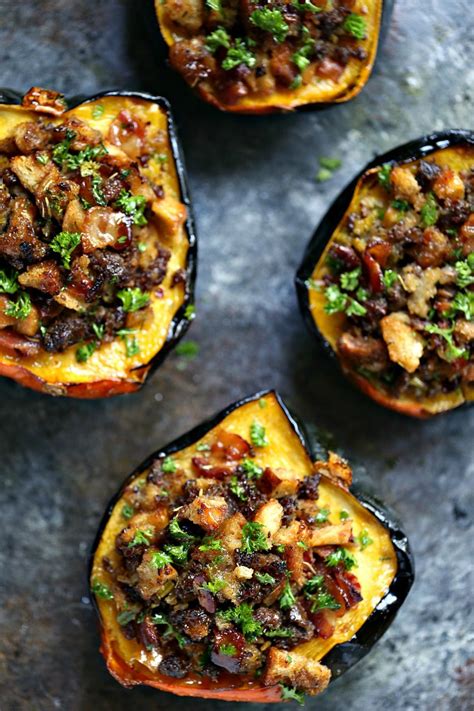 These roasted acorn squash are stuffed with israeli couscous and topped with a delicious maple tahini sauce! Stuffed Acorn Squash - Cravings of a Lunatic