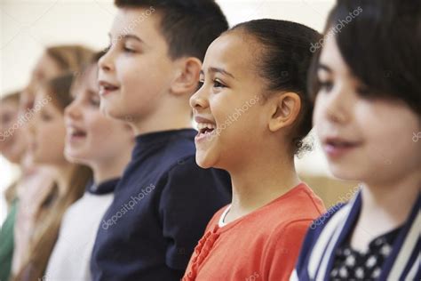 Group Of School Children Singing In Choir Together Stock Photo By