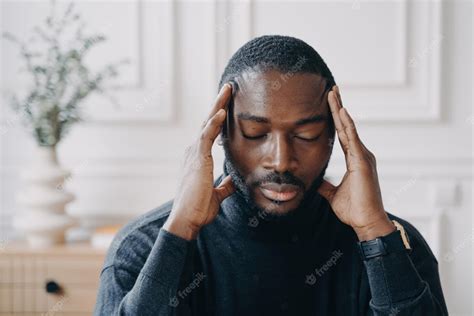 Premium Photo Exhausted Young Afro American Male Entrepreneur Sitting