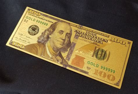 Golden 100 Bill Attracts Money