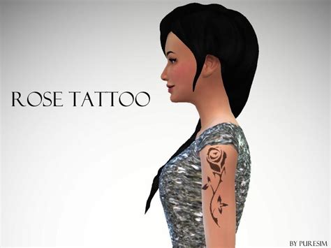 A Woman With A Rose Tattoo On Her Arm And Shoulder Standing In Front