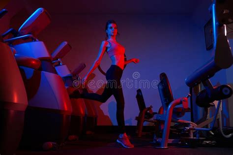 Slim Woman On Exercise Bicycle In Fitness Club Stock Image Image Of
