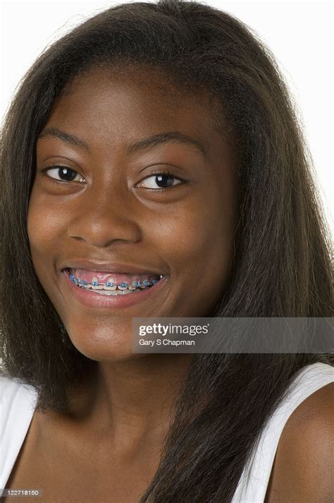 African American Female Teen With Braces Smiling Stock