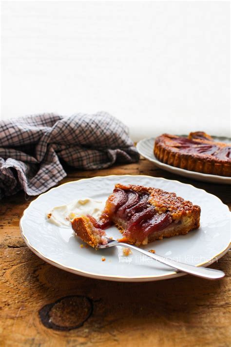 my little expat kitchen spiced red wine poached pear and frangipane tart