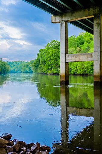 Under A Bridge With Chattahoochee River Reflections Stock Photo