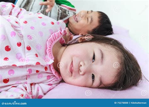 Closeup Asian Siblings Having Happy Together In Bed Before Sleep Stock