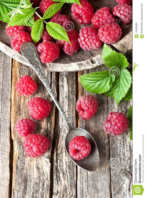 Fresh Raspberries With Leaves On Rustic Wooden Background Top V Stock