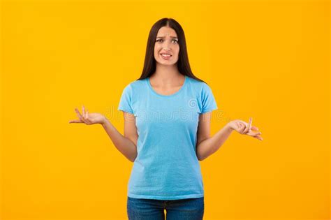 Confused Puzzled Young Woman Shrugging At Studio Stock Image Image Of