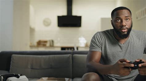 Smiling Black Man Playing Video Game At Home Stock Footage Sbv