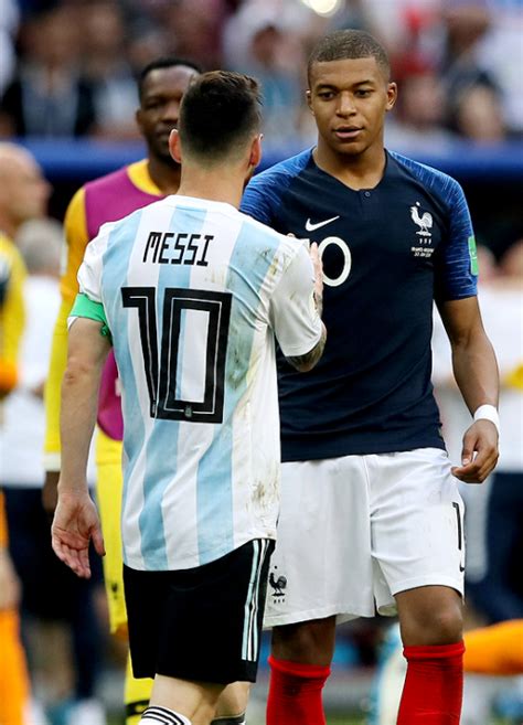 kylian mbappe of france consoles lionel messi of world cup daily