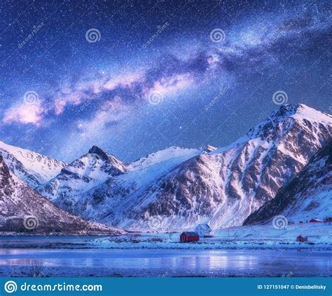 Milky Way Above Houses And Snow Covered Mountains In Winter Stock Image